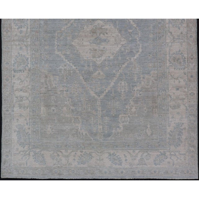 Modern Oushak With a Light Blue-Gray Background With Medallion & Tribal Motifs 5'10"x8'9" For Sale - Image 4 of 4