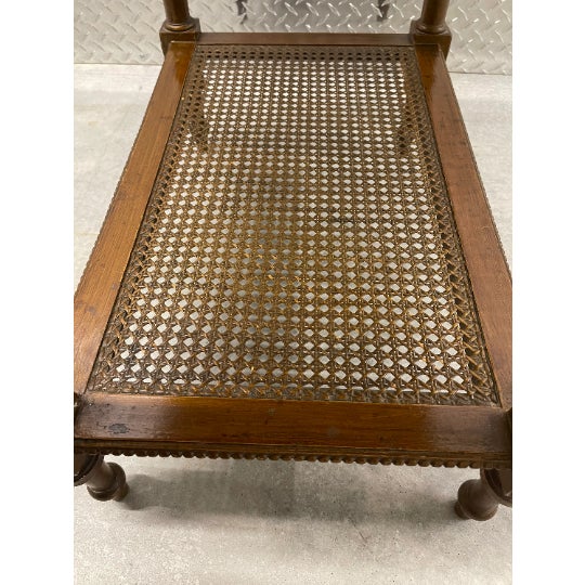 Circa 1920's French side table with marble insert table top, turned wood legs and two lower caned shelves.