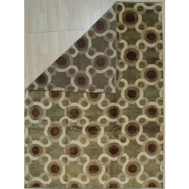 Talia Artistic Green Hand Knotted Wool Rug, Country of Origin: China. This contemporary hand-knotted piece offers a...