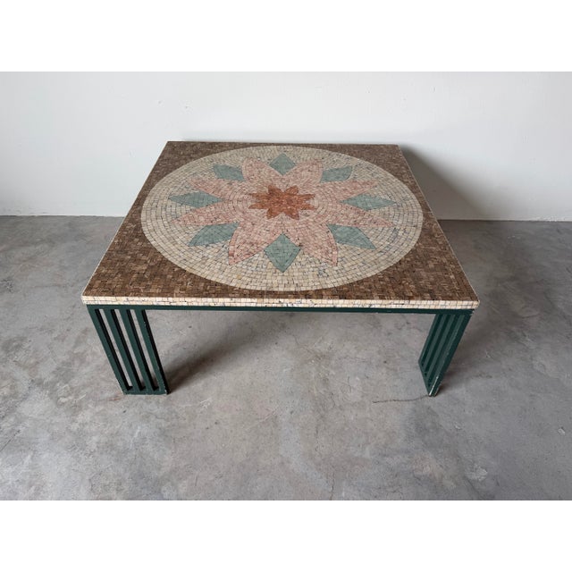 Striking circa 1980s coffee table featuring a beautifully detailed hand-laid mosaic top with a central floral medallion...