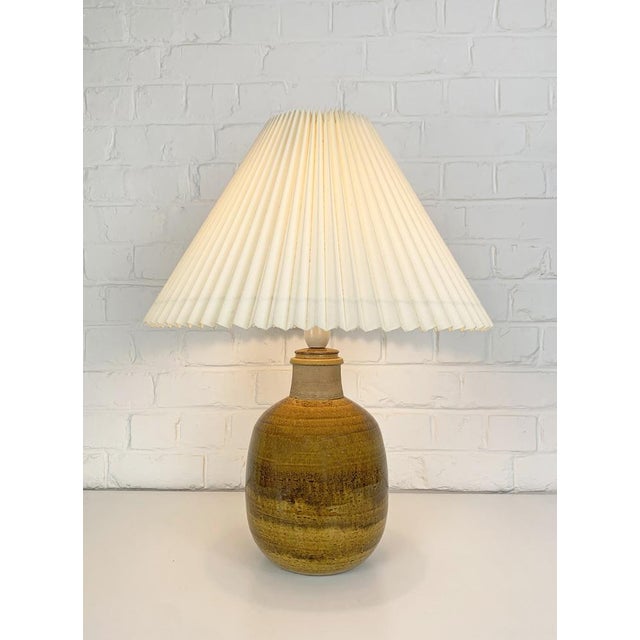 Big uranium yellow glazed chamotte (danish clay) table lamp designed by nils kähler in the 1960s or 1970s. manufactured by...