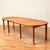 Dining table with 3 extension tops made in Denmark in the 1970s and 1980s. It is made of cherry veneer on the top and...