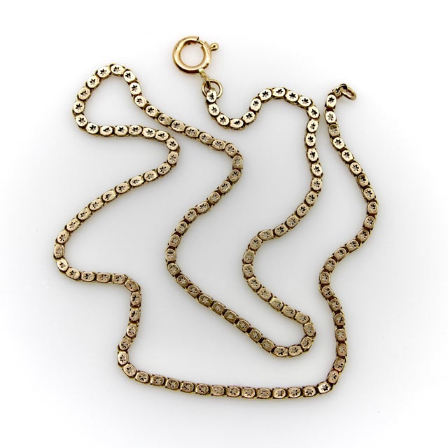 This early Victorian star link chain is a rare, hard-to-find treasure. Rendered in 10k gold, the chain consists of square...