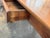 A 19th century French cherry farm table with a single drawer, pegged joinery at the corners, and square tapered legs. The...