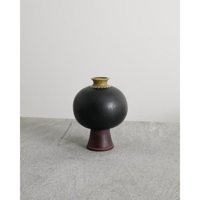 Rare Swedish mid century "Farsta" stoneware vase in dark green, brown and yellow glaze by Wilhelm Kåge for Gustavsberg...