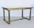 Attributed to Mastercraft (American, 1946-1985), probably 1970s. A polished brass and glass desk, writing table or dining...