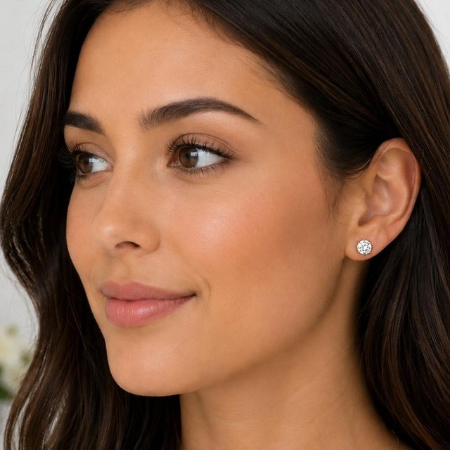 18k white gold 2/04 carat total weight stud earrings with 1.01 carat J VVS2 and 1.03 carat K VVS2 round brilliant diamonds