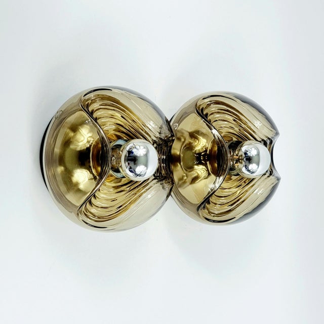 Stunning pair of wall lamps/sconces "Wave" model (also called "Futura") designed by Koch & Lowy for Peill & Putzler,...