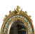 Victorian French mirror with champleve enamel trim featuring a cherub sitting atop of the frame. Enamel design is floral...