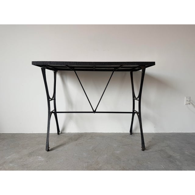 Beautiful vintage outdoor patio table featuring a hand-painted ceramic tile top with a vibrant Spanish Revival-inspired...