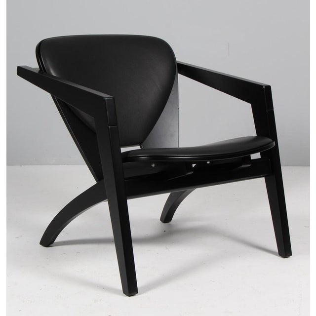 Hans j. Wegner lounge chairs new upholstered with black aniline leather. Frame of solid new black lacquered beech. Model...