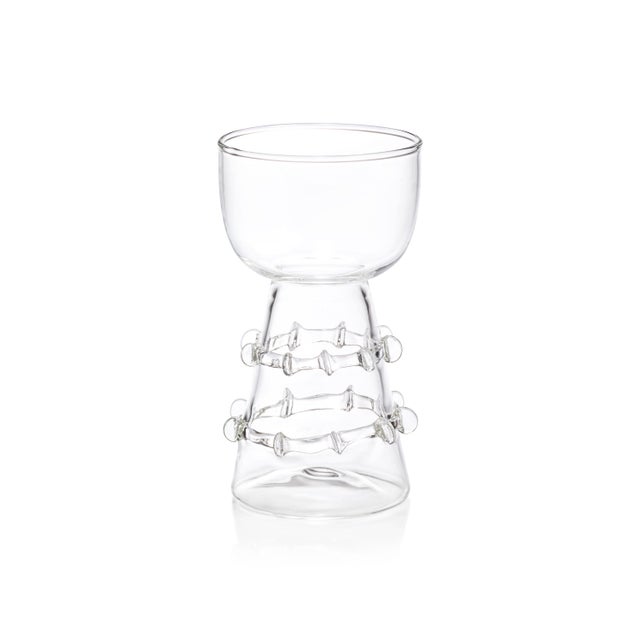 This eclectic set of four borosilicate glass vases brings a touch of artistry to floral arrangements. Each vase features a...