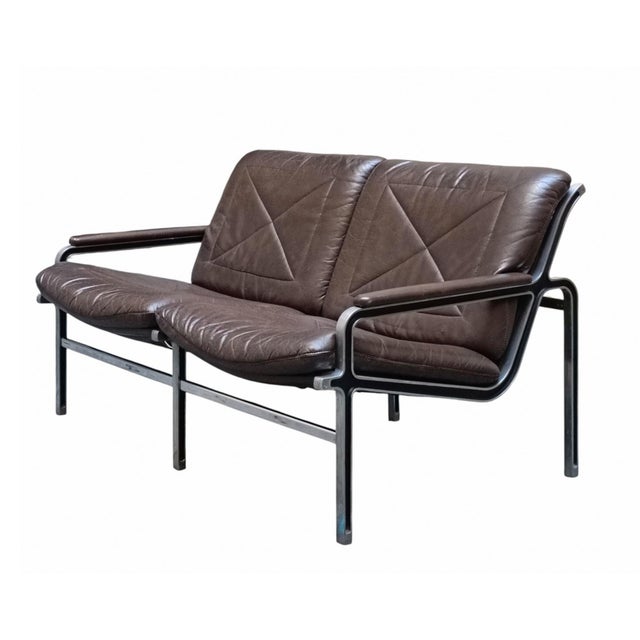 High-quality, elegantly designed two-seater sofa, manufactured by Strässle International in the 1960s, in cast aluminum...