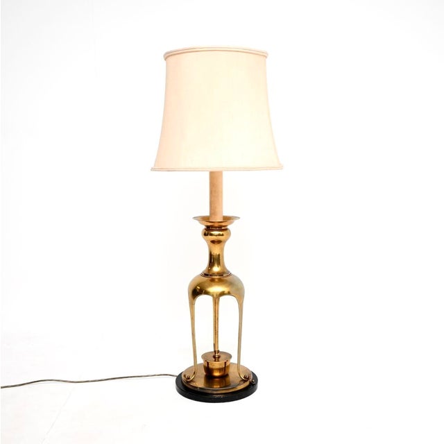 A stylish and very large vintage brass table lamp, made in England and dating from around the 1960’s. This is an...