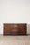 18th century English oak dresser base with raised-panel cupboard doors, aged brass hardware, and rich patina. Georgian...