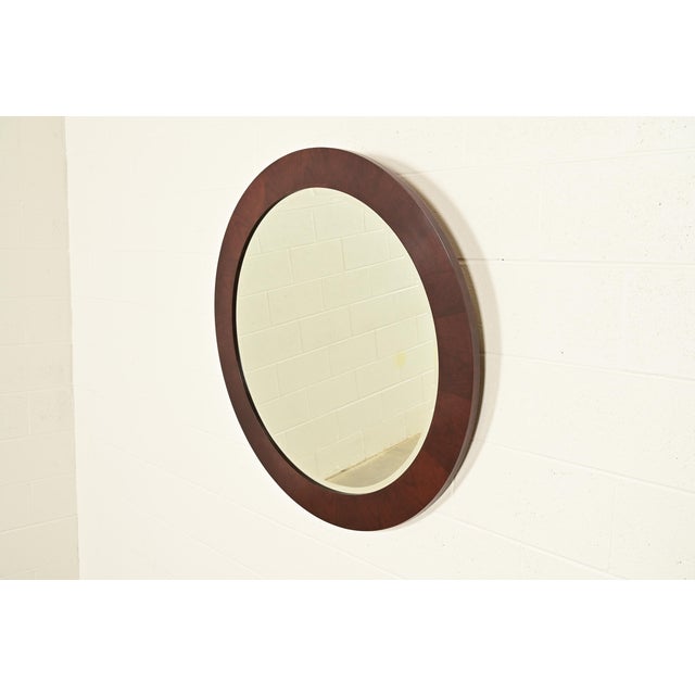 A gorgeous Modern Art Deco style mahogany framed beveled wall mirror By Stickley USA, 2005 Measures: 40"W x 1"D x 40"H....