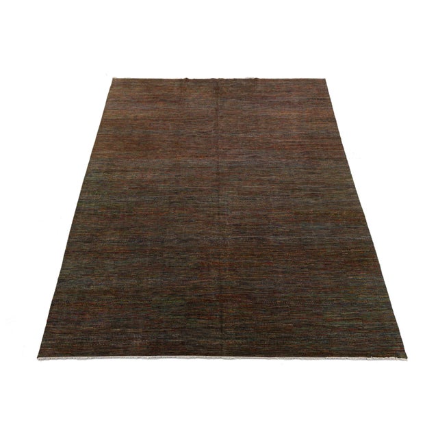 Elevate your space with the understated elegance of the Savannah Modern Collection. This hand-knotted Indian wool rug...