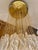 Exceptional cascade pendant with eclipse glass Murano by Mazzega oversized with gilt gold structure. The Design and the...