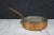 Copper Saute Pan, copper exterior with stainless steel interior, bent handle with looped opening at end. Handle measures...