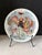 This elegant Limoges porcelain plate from D’Arceau’s Les Femmes du Siècle series captures the theatrical sophistication of...
