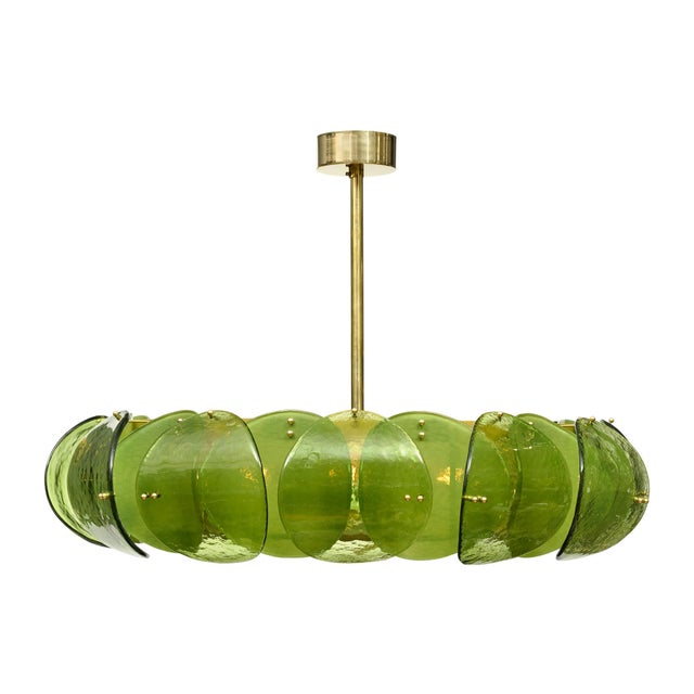 Chandelier from the island of Murano outside of Venice, Italy. This fixture is crafted with curved, green hand-blown glass...