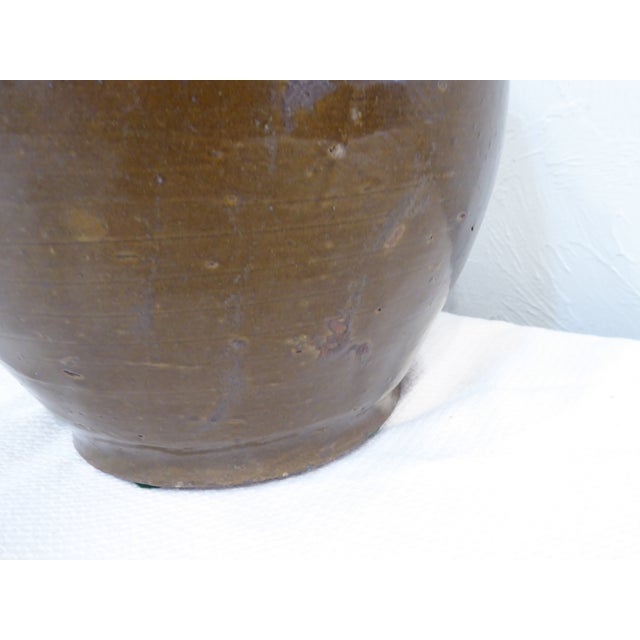 This Chinese rice wine jar has loop handles which were used to add twine for carrying.