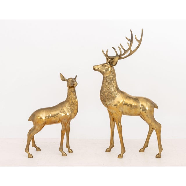 Pair of Stag and Doe Large Brass Sculptures. Taller: 48.75" H x 27" W x 15.25" D. Provenance: From a 500 Park Avenue Estate.
