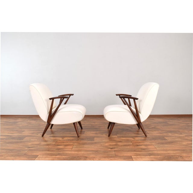 A very rare pair of armchairs type 300-110 produced in the 1960s by Gościcińska Fabryka Mebli in Poland. The armchairs...