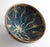 A striking Chinese stoneware tea bowl in the temmoku tradition, featuring a dramatic tortoiseshell glaze. The interior...