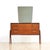 This mid-century vanity dresser was produced in England during the 1960s. A sleek vintage bedroom storage piece with...