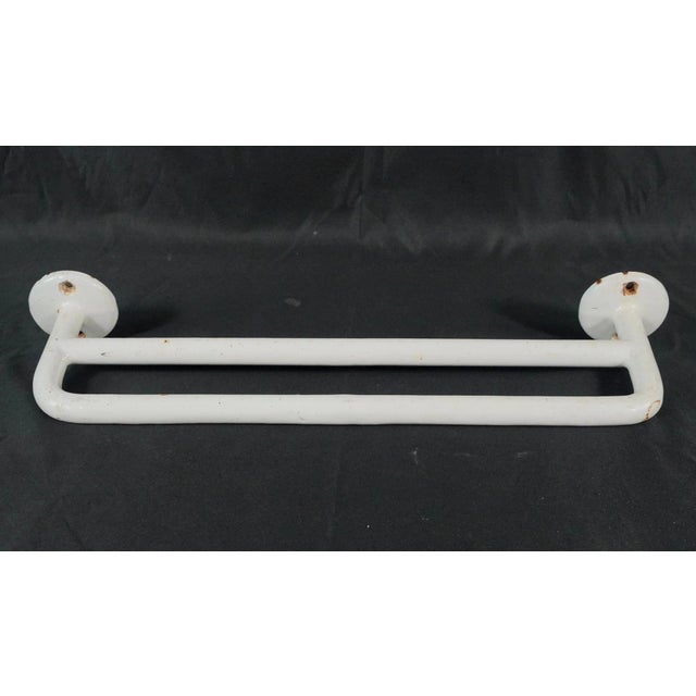 Vintage European French towel rack made of white enameled cast iron with a double bar layout. This style of rack was used...