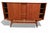 An incomparably beautiful and well-made Danish cabinet from the 1950s/1960s. The cabinet is made of teak with a golden...
