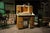 Antique watchmaker's or jeweler's workbench featuring an extensive arrangement of small parts drawers, storage...