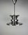 This exceptional danish pendant lamp from the 1970s embodies the bold, futuristic design language of the space age era....
