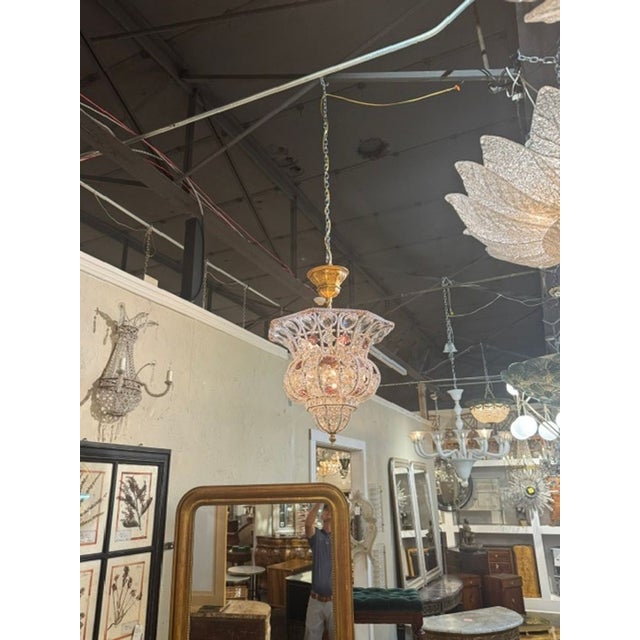 The French Maison Bagues Manner Beaded Bell Shape Chandelier is a stylish and elegant lighting fixture perfect for adding...
