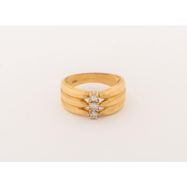 14K Yellow Gold Diamond Ring, featuring three prong set round brilliant cut diamonds weighing a total of approx. 0.20...