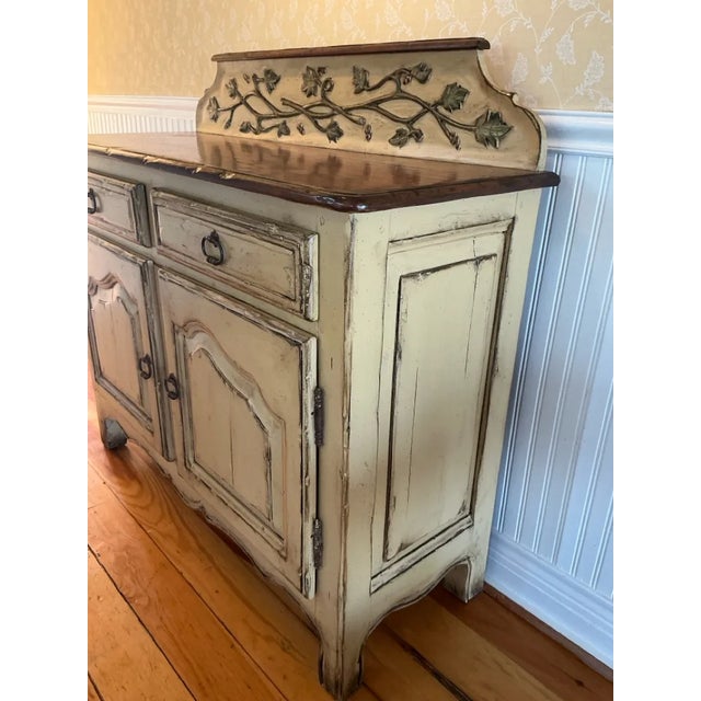 This delightful vintage Woodland Furniture French Provincial-style buffet sideboard brings a touch of Tuscan charm to any...