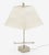 Pierre. Cardin chromed metal table lamp with a squared base and thin silhouette. The chrome barbell spins with a little...