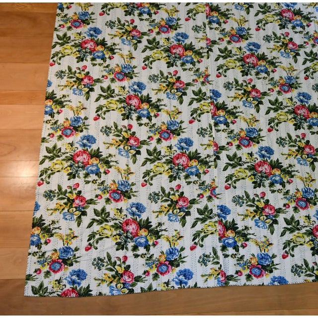 This is a handmade Kantha blanket quilted by Bengali women from discarded cloth.