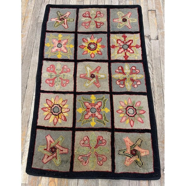 "Dating back to circa 1880, this Antique American Hooked rug serves as a charming and authentic piece of late 19th-century...