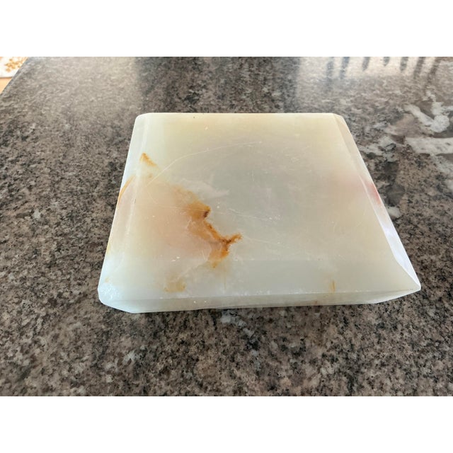 Lovely alabaster stone ashtray. Nicely neutal creamy color with coppery/brown accents throughout the stone. Also can be...