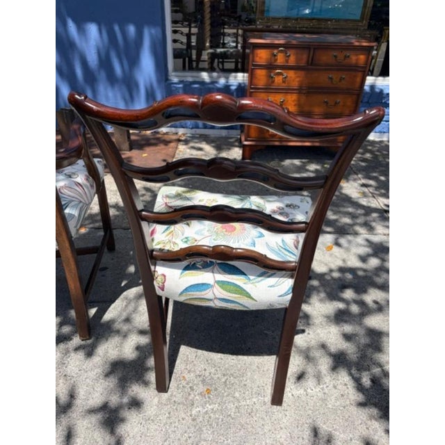 This set of 12 Georgian style 1950s mahogany ribbon back dining room chairs is a true vintage find. Each chair is fully...
