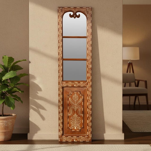 Dimensions: 18" W x 2" D x 71.5" H This vintage, bone inlaid door panel has been repurposed into a mirror wall art. The...