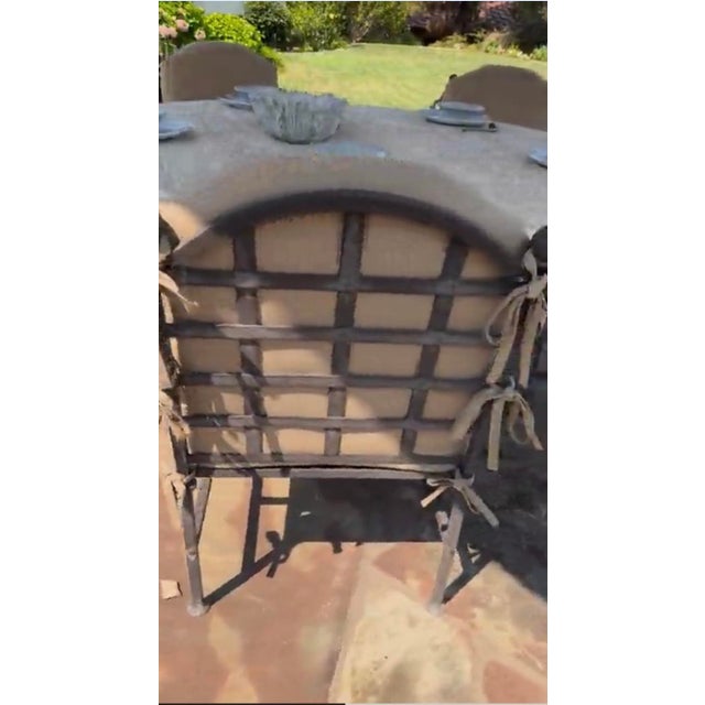 Kreiss Capri patio dining set. Table and 5 chairs. The set includes travertine top and base. Top is 60’’ in dia. The set...