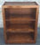 A Mid Century Stained Pine Low Bookcase Measures 24" in width, 12.75" in depth and 30.75' in height