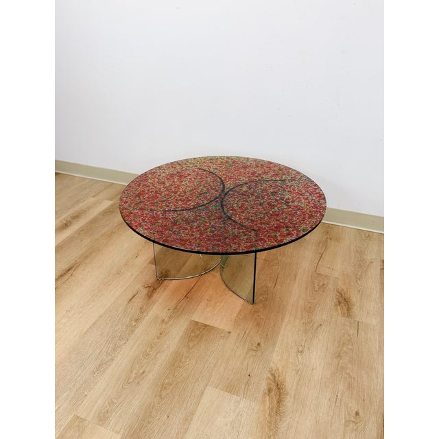 This striking vintage postmodern confetti round coffee table is a bold and genuinely eye-catching living room find. The...