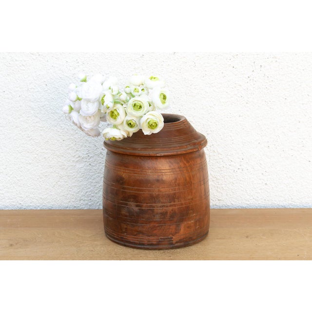 This Indus Grain Vessel is a soulful study in organic geometry. Hand-turned from a single, solid block of seasoned Teak...
