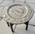 Anglo-Indian hammered brass/copper alloy tray table. The tray features an elaborate hunting scene of the Raja on an...