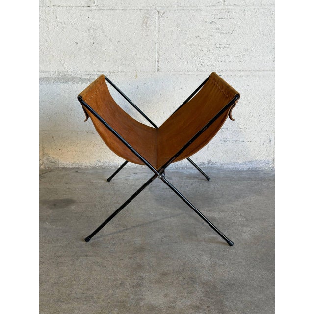 This sophisticated magazine holder combines rich brown suede with a sleek black metal frame. Its minimalist folding...