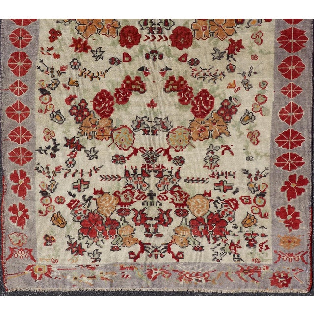 Vintage Turkish Oushak Rug in All-Over Flower Design Background & Simple Boteh Border For Sale - Image 9 of 13